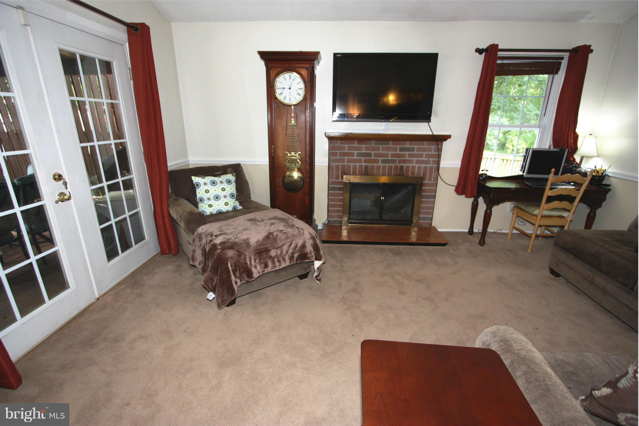 8644 Heathermill Road Nottingham, MD 21236 - Photo 13 of 30 WOOD BURNING FIREPLACE / ACCESS TO COVERED DECK