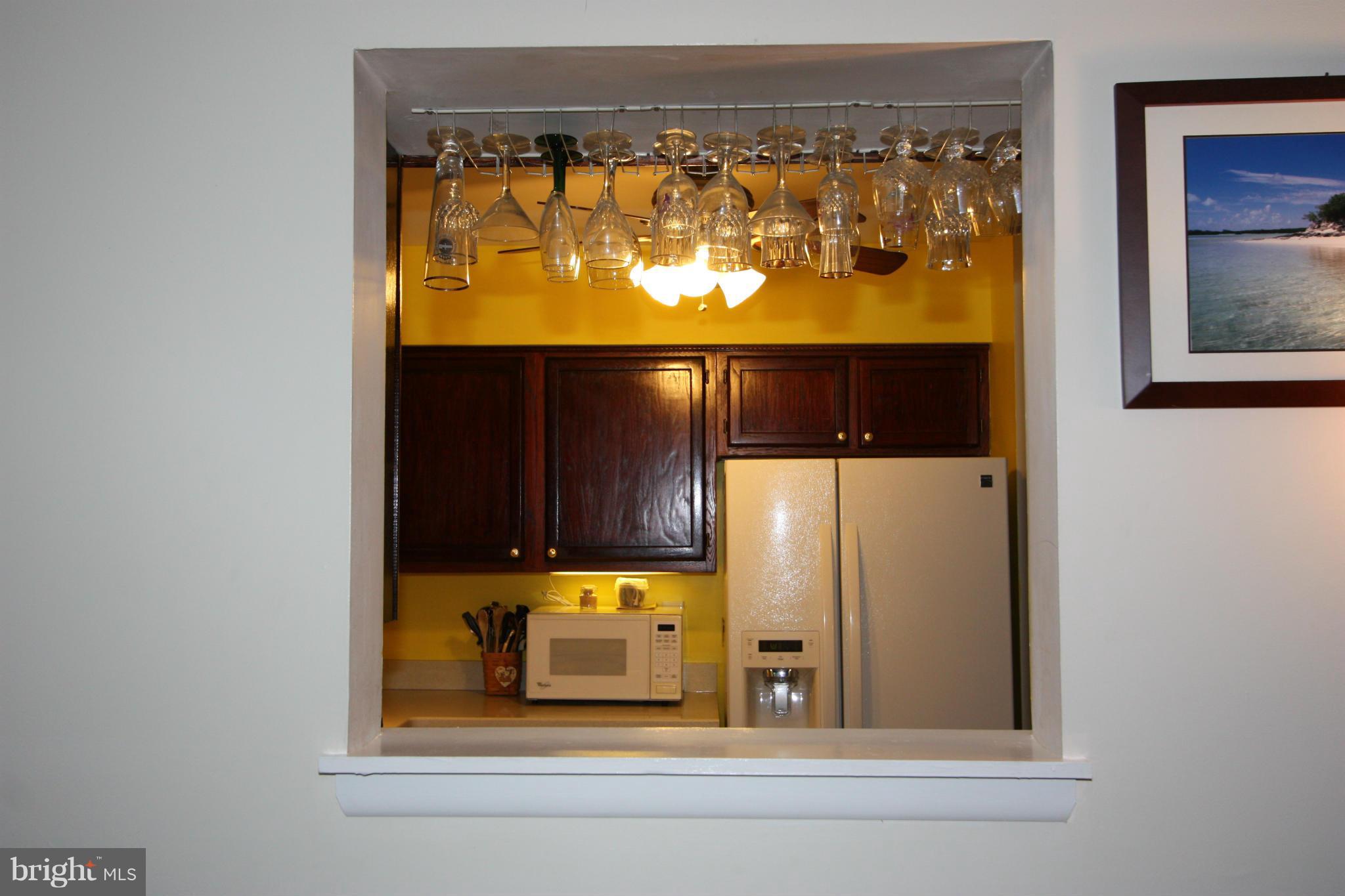 8644 Heathermill Road Nottingham, MD 21236 - Photo 16 of 30 WINDOW BETWEEN FAMILY ROOM AND KITCHEN IS HANDY