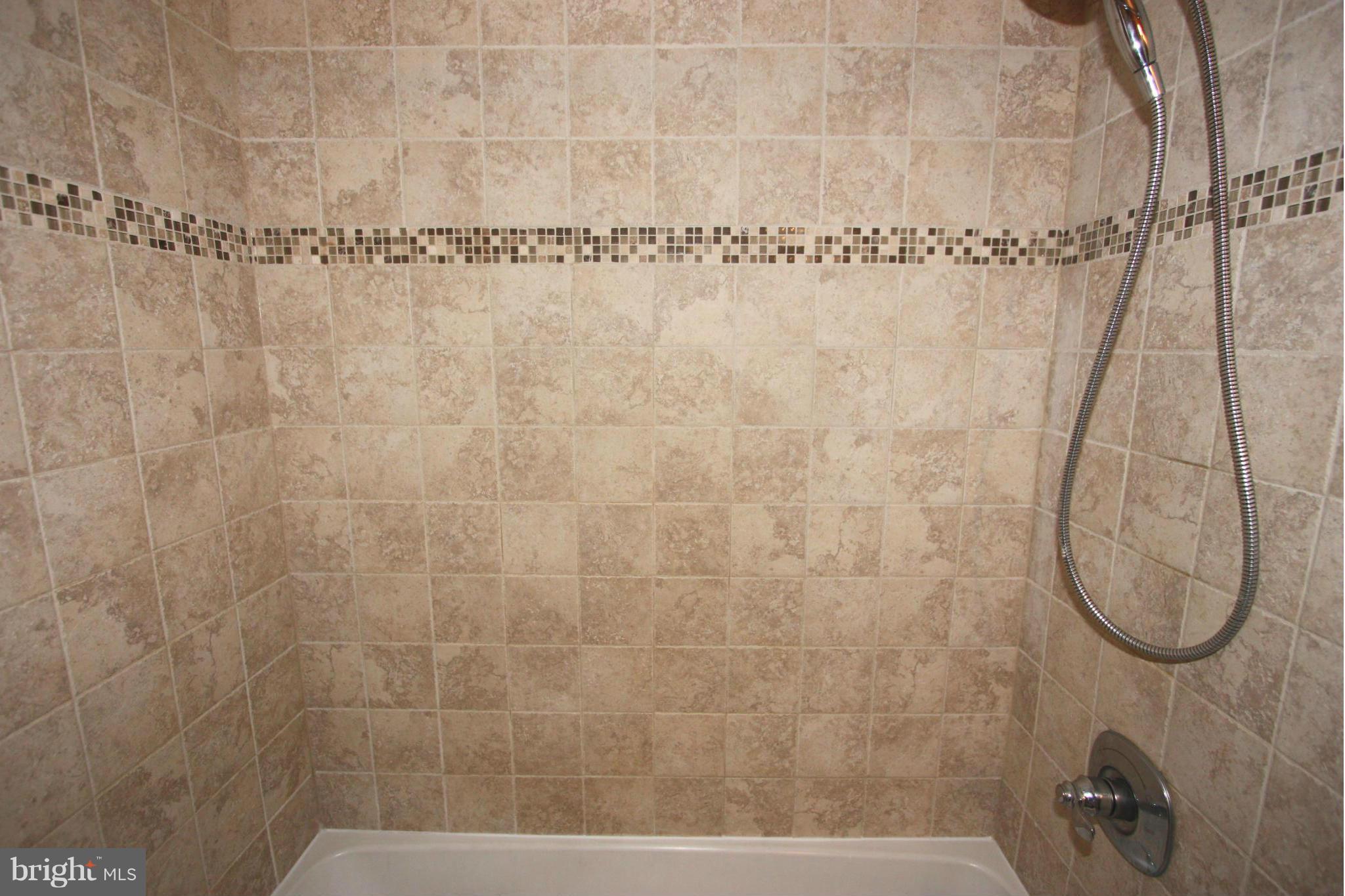 8644 Heathermill Road Nottingham, MD 21236 - Photo 23 of 30 FULL BATHROOM #2 HAS CERAMIC TILE TUB SURROUND