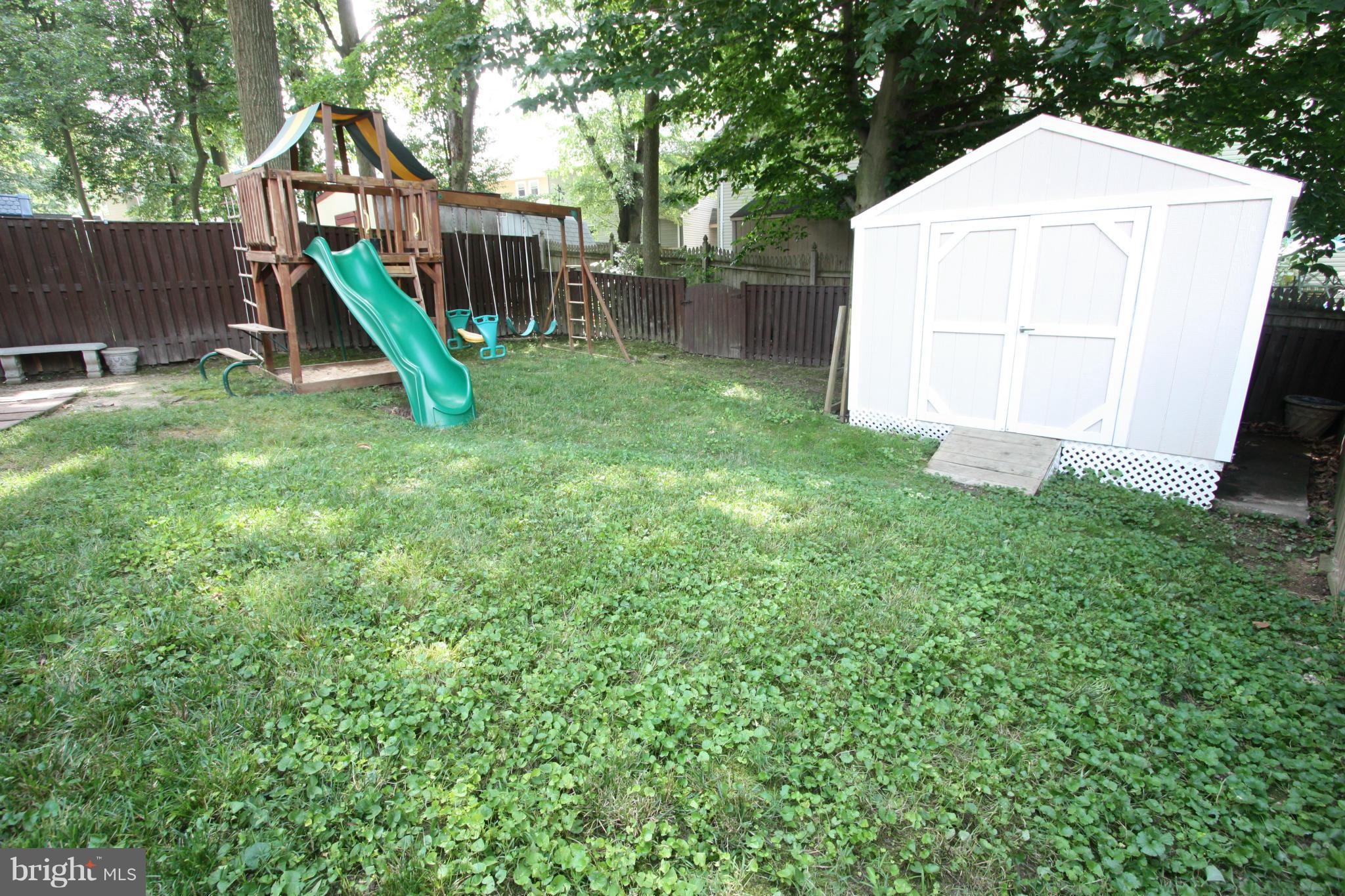 8644 Heathermill Road Nottingham, MD 21236 - Photo 26 of 30 FULLY FENCED REAR YARD WITH LARGE STORAGE SHED