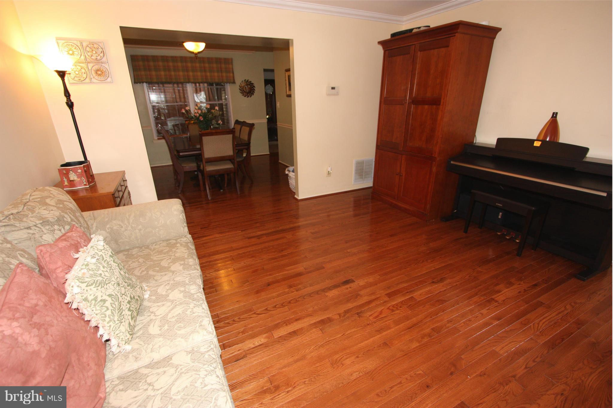 8644 Heathermill Road Nottingham, MD 21236 - Photo 10 of 30 LIVING ROOM FLOWS INTO THE DINING ROOM