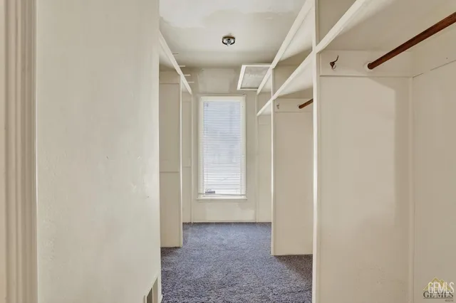 a view of a bathroom from a hallway