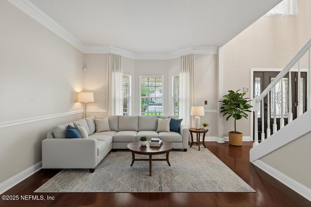 53 Tallwood Road Jacksonville Beach, FL 32250 - Photo 21 of 62 a living room with furniture and a potted plant