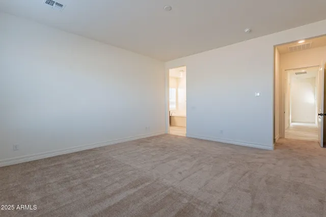 a spacious bathroom with a tub sink shower and mirror