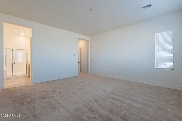 a en suite bathroom with a sink and a mirror