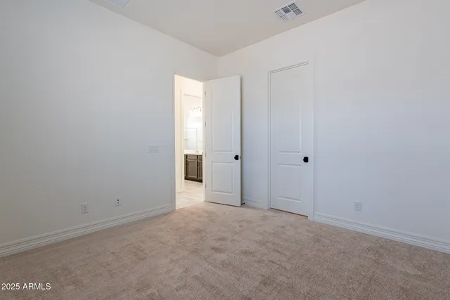 a view of an empty walk in closet