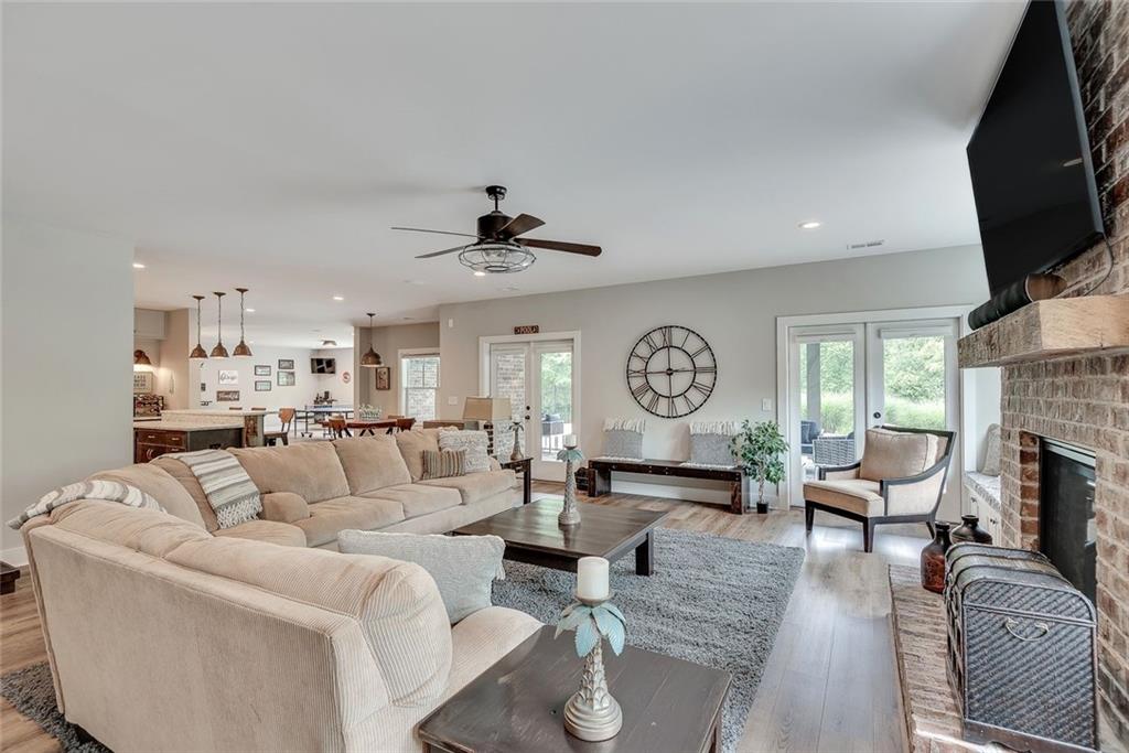 2503 Sugar Pike Road Canton, GA 30115 - Photo 129 of 134 a living room with fireplace furniture and a flat screen tv