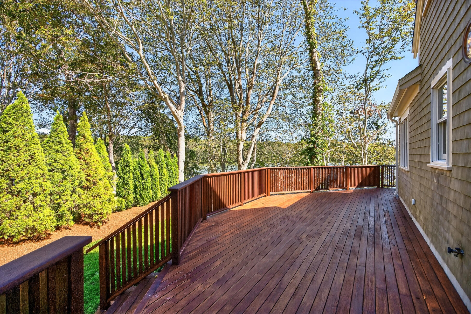 131 Timberlane Drive Mashpee, MA 02649 - Photo 14 of 57 a view of balcony with wooden floor and fence