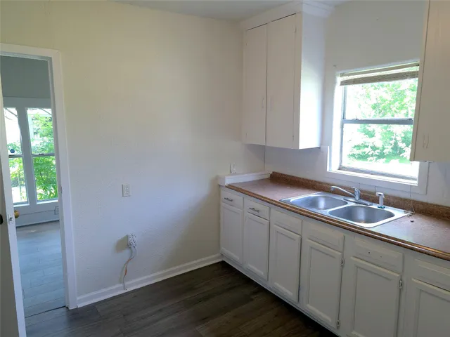 a kitchen with a sink and cabinets