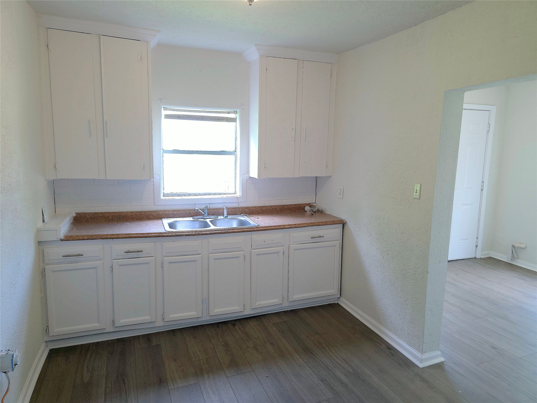 2204 Highway 3 Dickinson, TX 77539 - Photo 14 of 29 a bathroom with granite countertop white cabinets and a sink