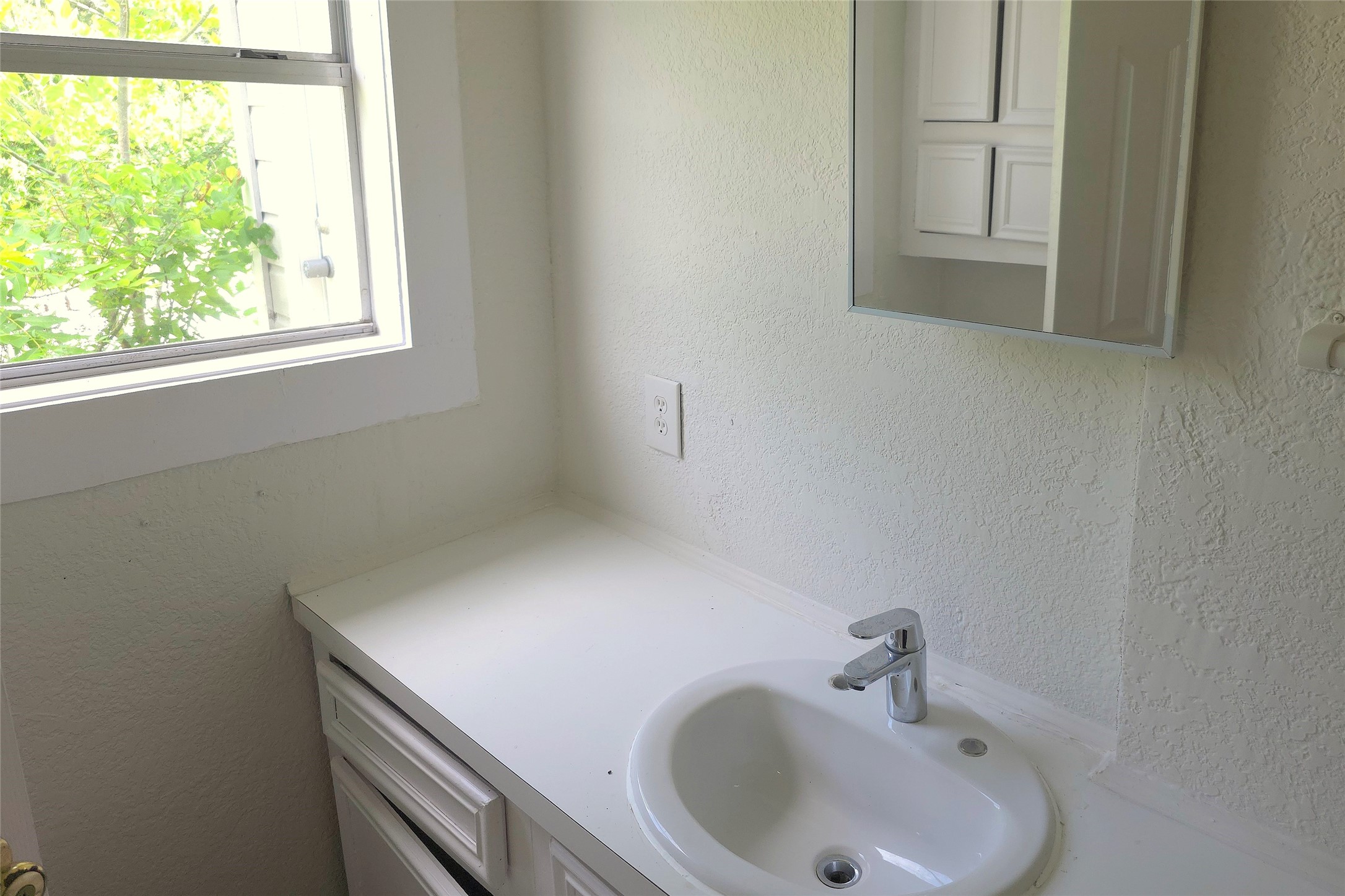 2204 Highway 3 Dickinson, TX 77539 - Photo 22 of 29 a bathroom with a sink and a window
