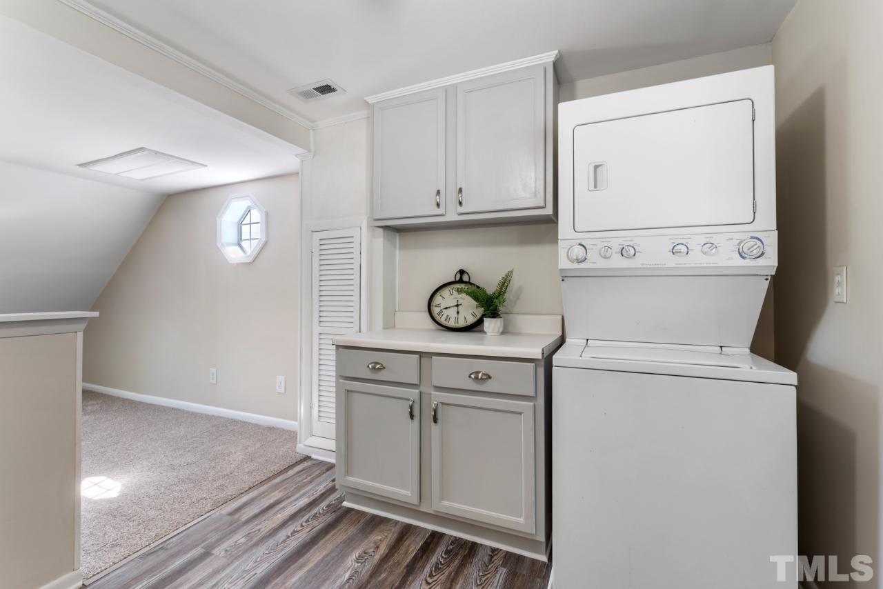 1955 Bernard Street Raleigh, NC 27608 - Photo 20 of 42 a view of washer and dryer with wooden floor