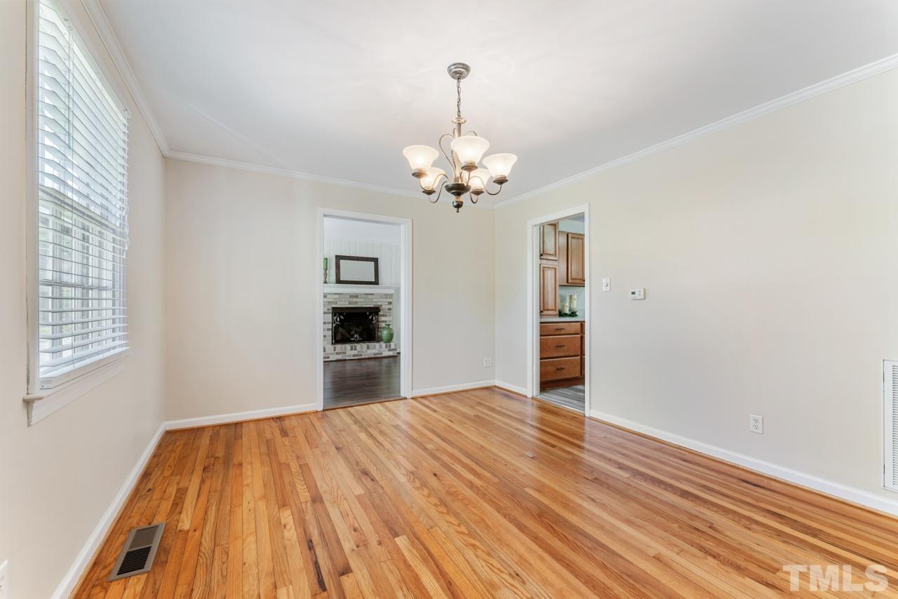1955 Bernard Street Raleigh, NC 27608 - Photo 2 of 42 a view of a room with wooden floor and a window