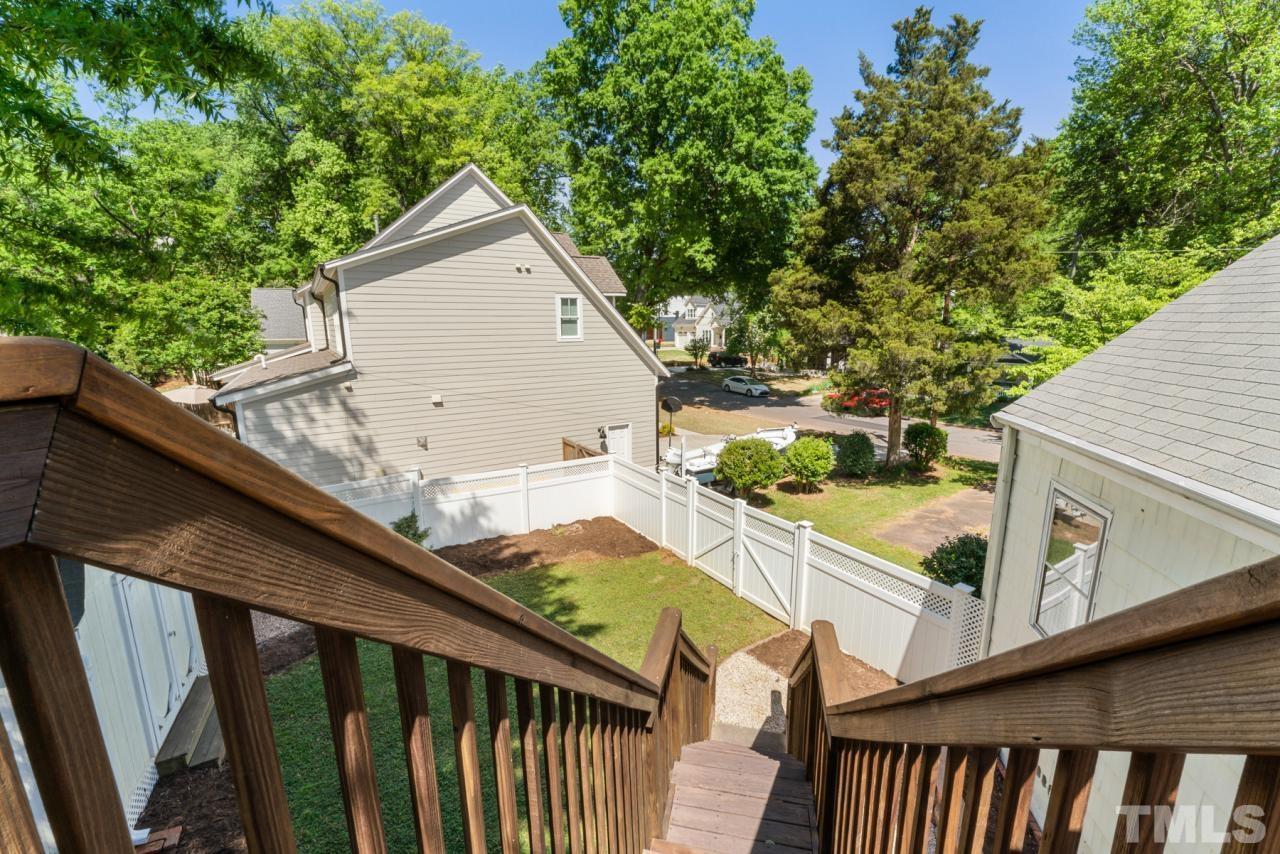 1955 Bernard Street Raleigh, NC 27608 - Photo 26 of 42 a view of a balcony with wooden floor and fence