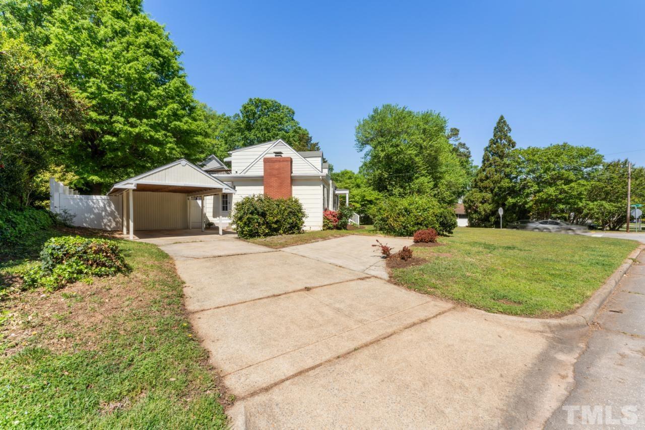 1955 Bernard Street Raleigh, NC 27608 - Photo 29 of 42 a front view of a house with a yard and garage