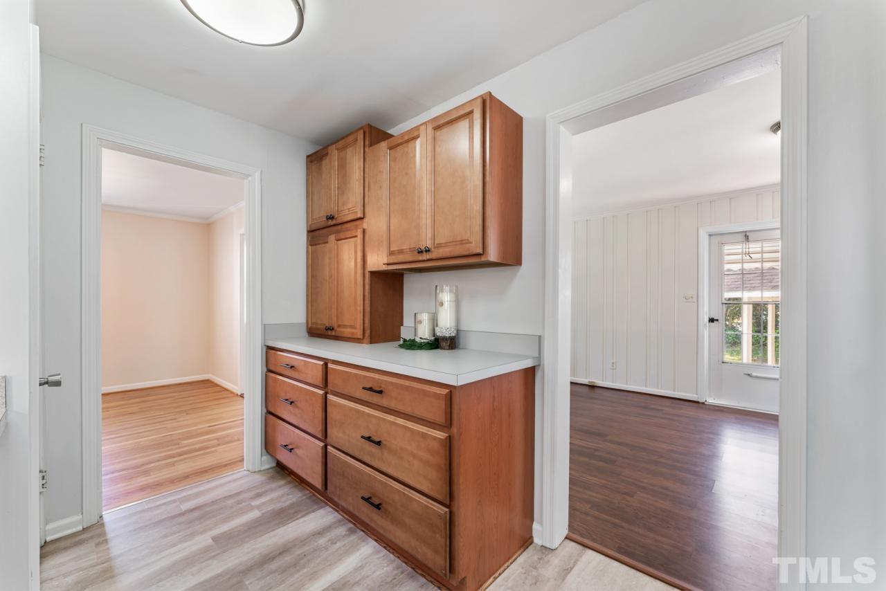 1955 Bernard Street Raleigh, NC 27608 - Photo 9 of 42 a kitchen with stainless steel appliances granite countertop a stove a sink and a microwave