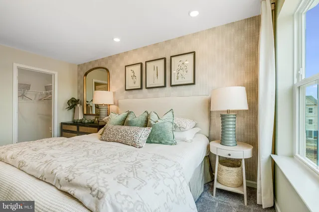 a bedroom with a bed and a lamp with table