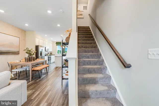 a view of a living room and dining room