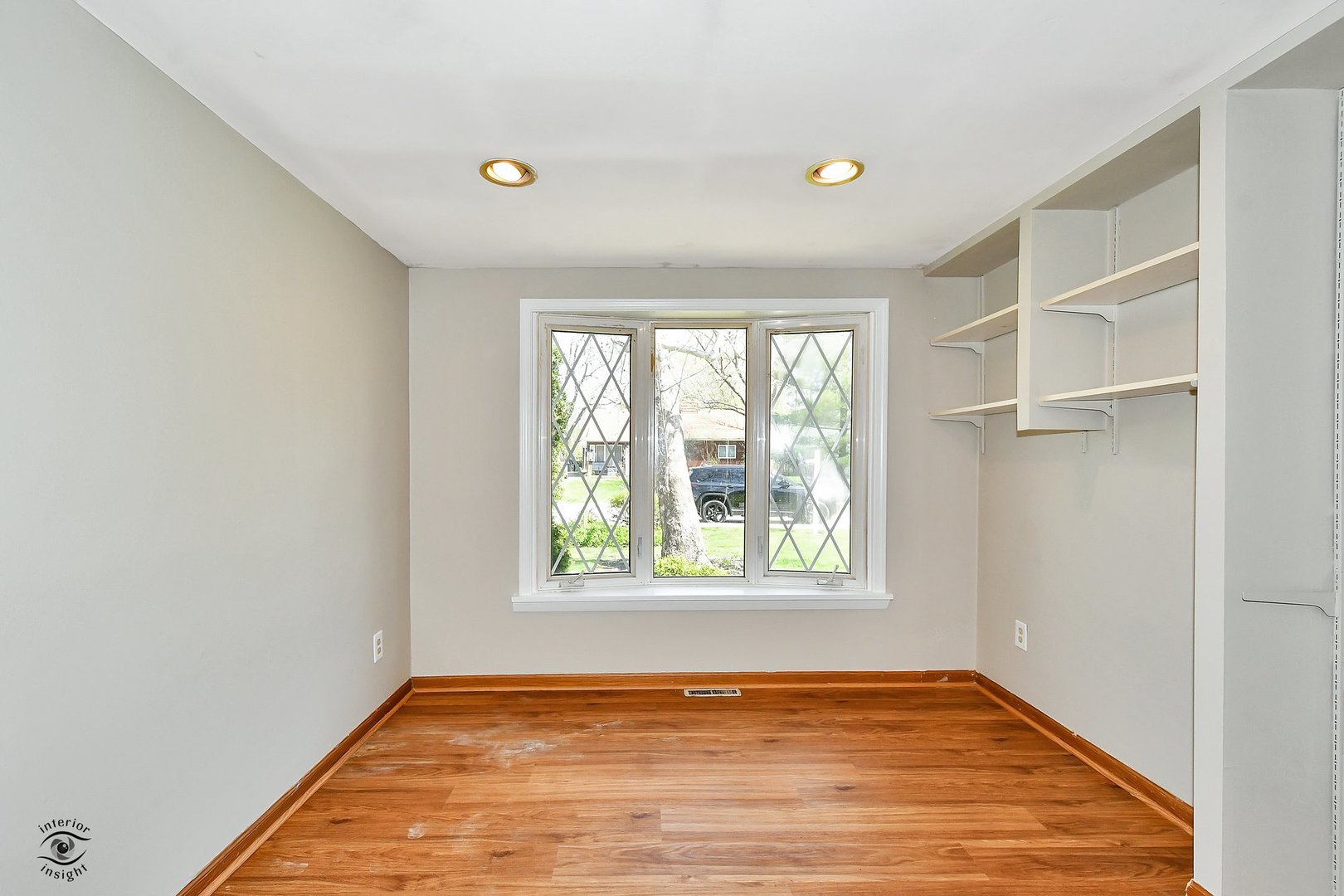 524 Elder Lane Glenview, IL 60025 - Photo 5 of 22 a view of an empty room with wooden floor and a window