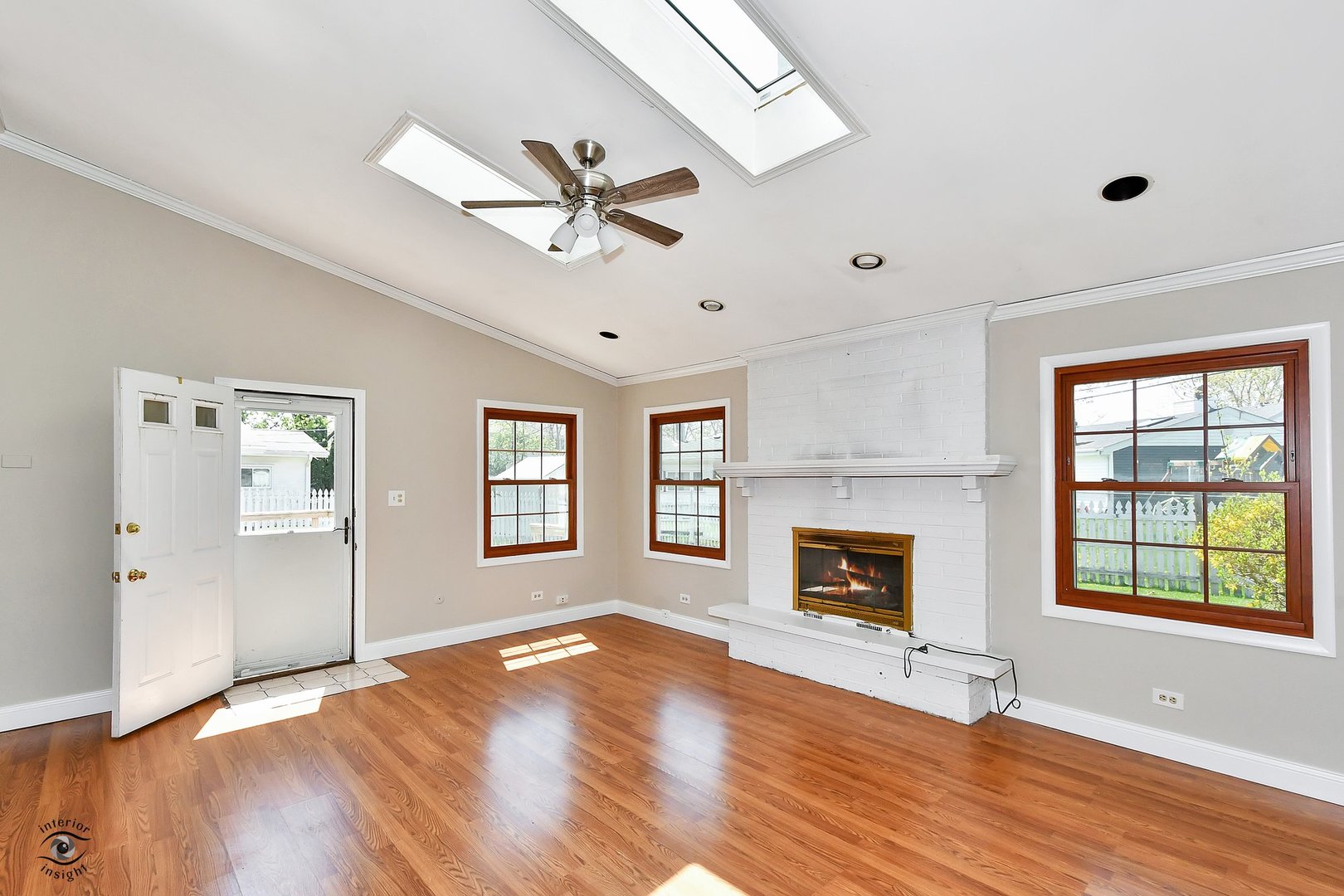524 Elder Lane Glenview, IL 60025 - Photo 9 of 22 a view of an empty room with window and fire place