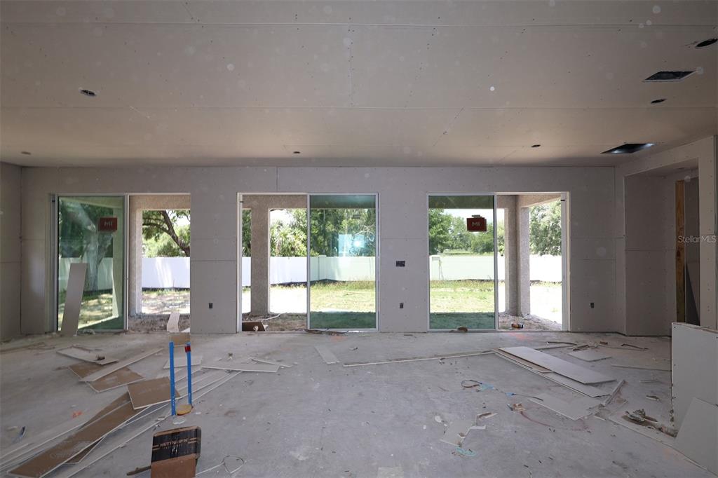 3850 Wolves Crk Place Apopka, FL 32712 - Photo 5 of 11 a view of an empty room with large windows