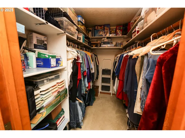 a bedroom with a bed and a mirror