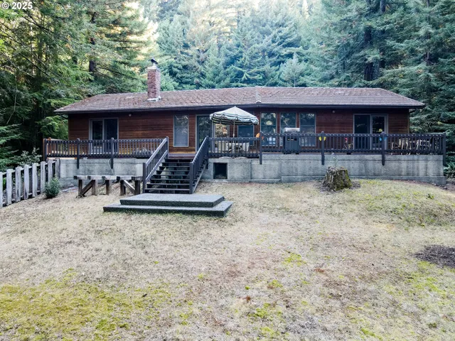 an aerial view of a house with a yard table and chairs