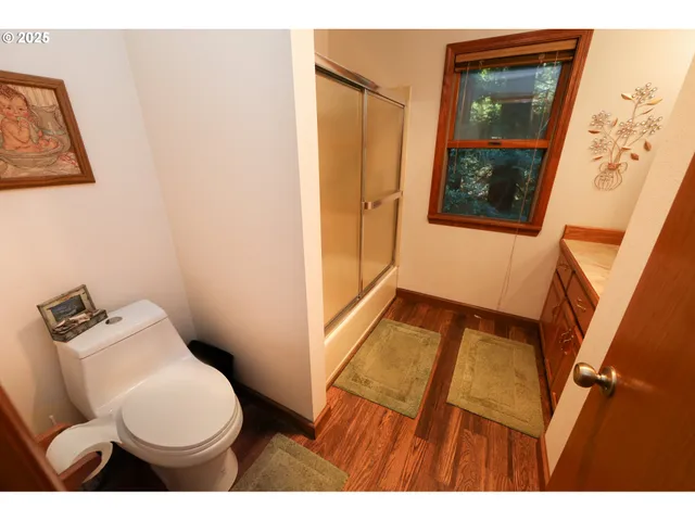 a view of walk in closet with clothes