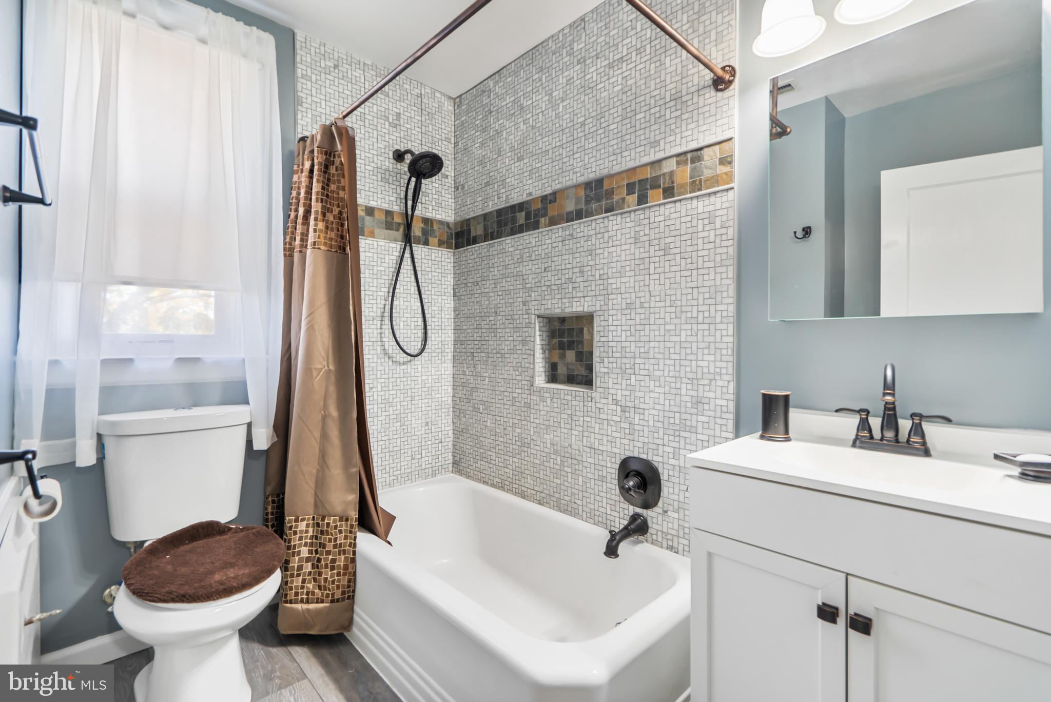3704 Monterey Road Baltimore, MD 21218 - Photo 22 of 32 a bathroom with a sink toilet and shower