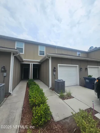 a front view of a house with a garage
