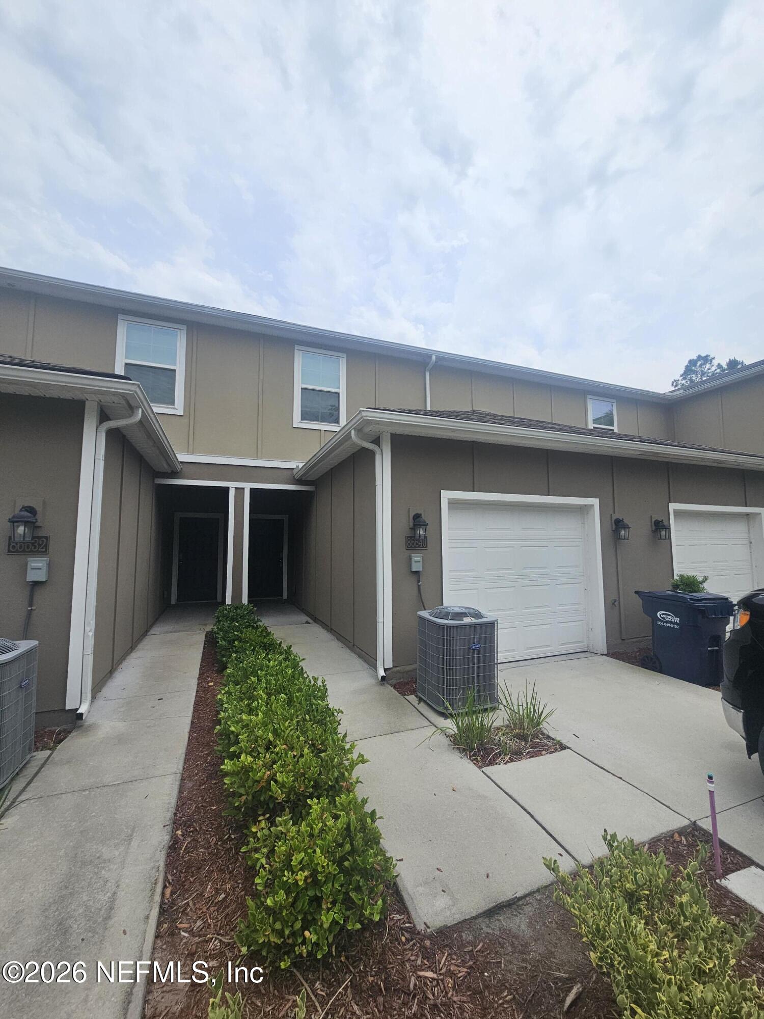 a front view of a house with a garage