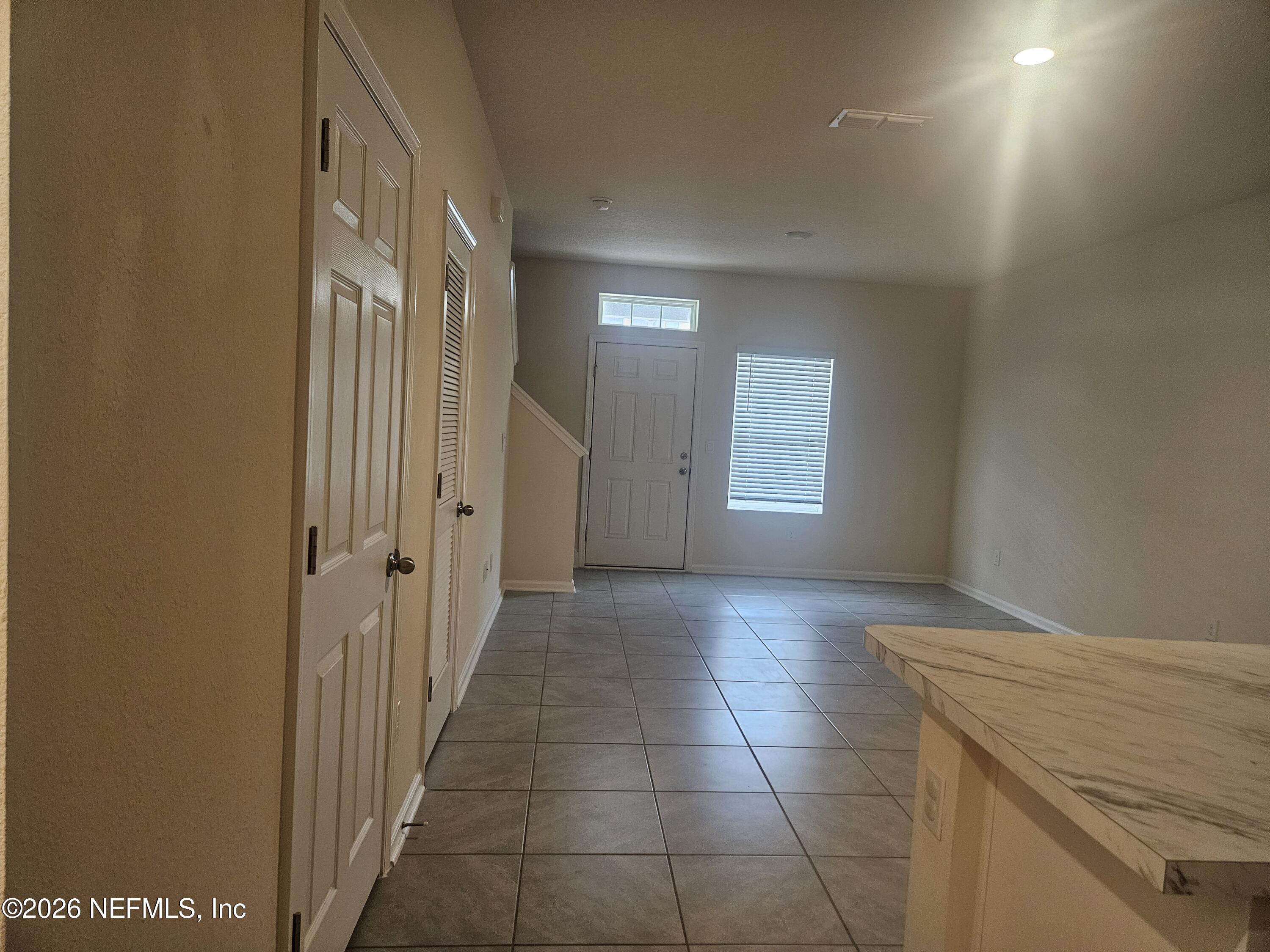86640 Shortline Circle Yulee, FL 32097 - Photo 3 of 11 a view of a hallway to rooms and stairs