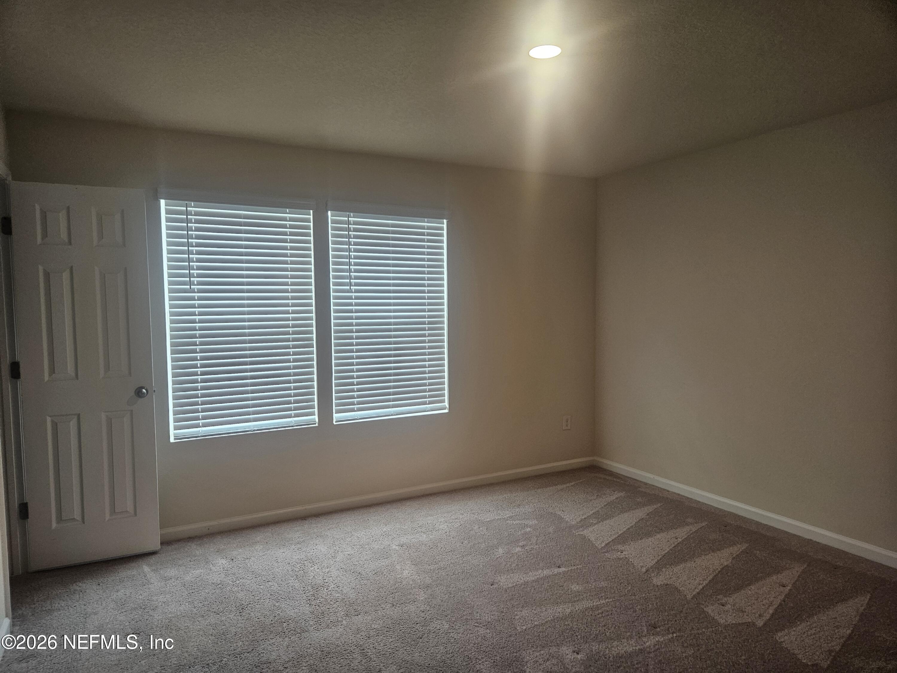 86640 Shortline Circle Yulee, FL 32097 - Photo 8 of 11 an empty room with a window