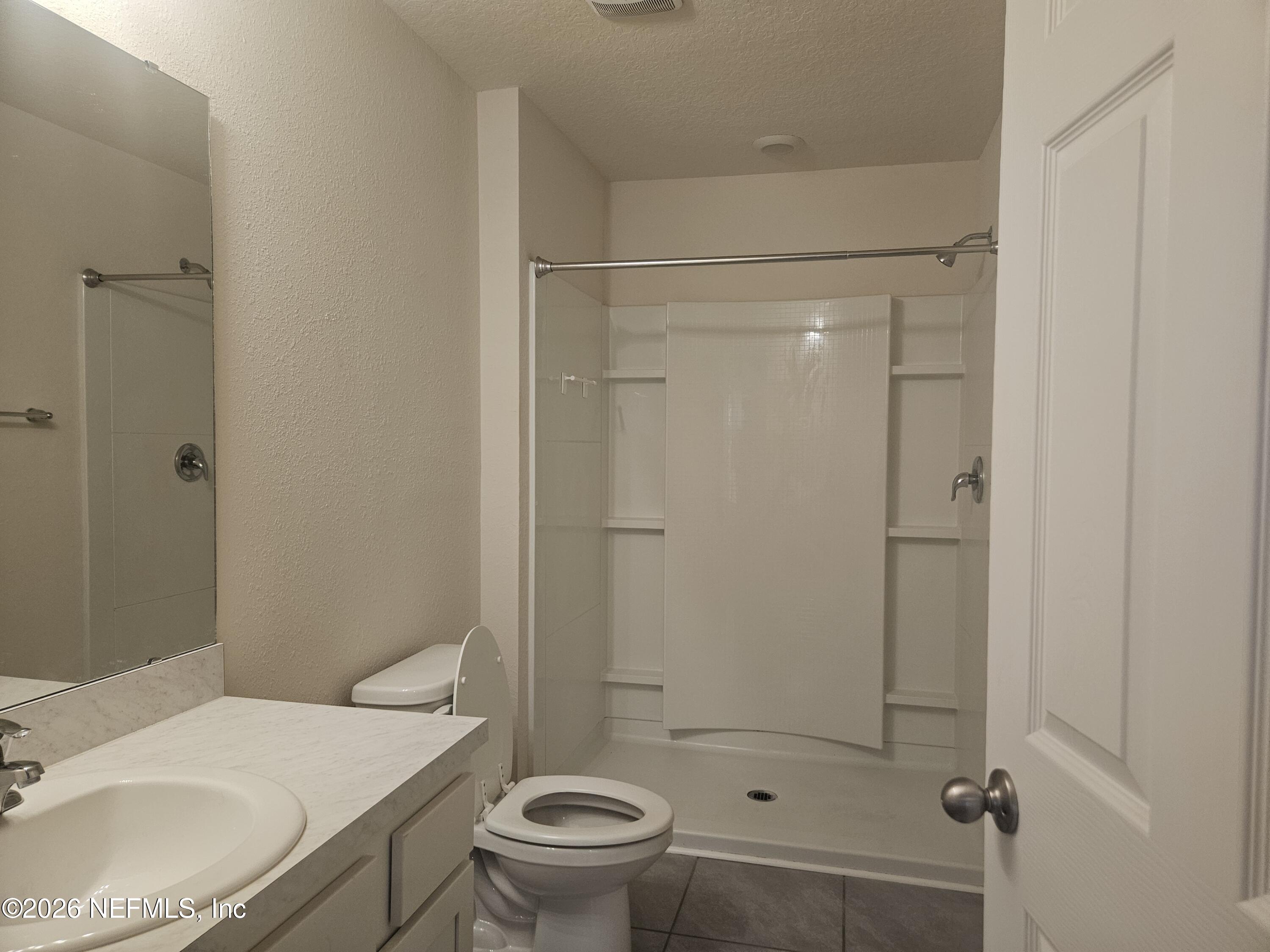 86640 Shortline Circle Yulee, FL 32097 - Photo 9 of 11 a bathroom with a sink toilet and shower