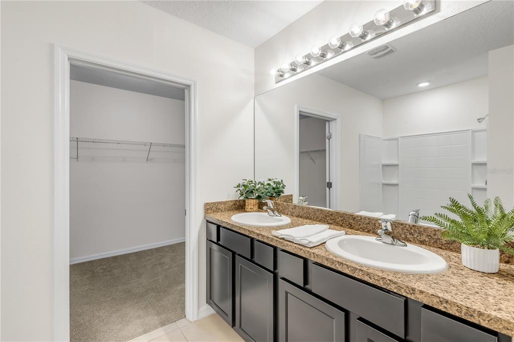 48 Hickory Loop Ocala, FL 34472 - Photo 28 of 52 a bathroom with a granite countertop sink and a mirror