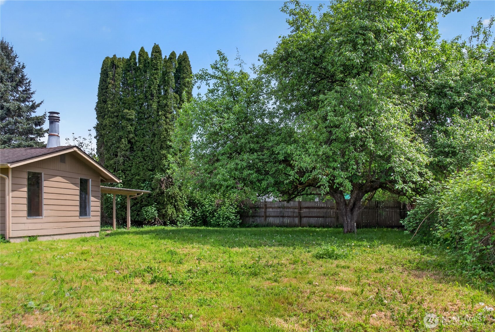 716 Murphy Way Sultan, WA 98294 - Photo 29 of 31 a backyard of a house with lots of green space