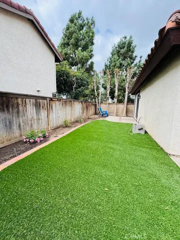 a view of a back yard of the house