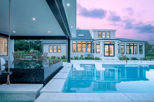 a kitchen with stainless steel appliances granite countertop a sink and a stove