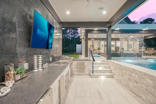a kitchen with stainless steel appliances granite countertop a sink and a stove