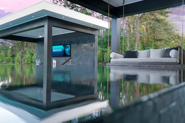 a kitchen with stainless steel appliances kitchen island granite countertop a refrigerator and a sink