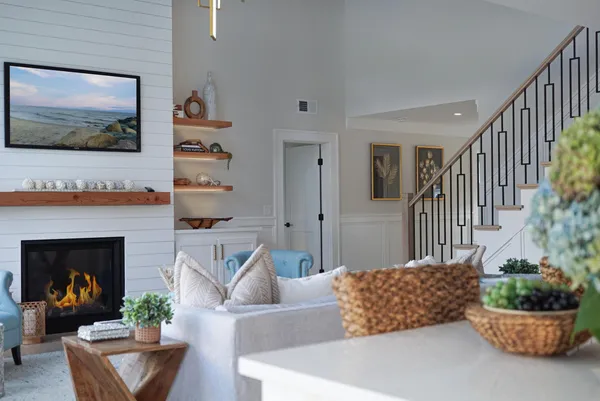 a bedroom with furniture and a wooden floor