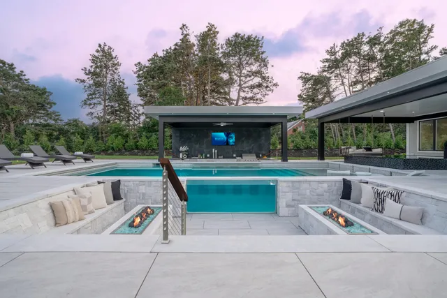 a view of a swimming pool with a yard