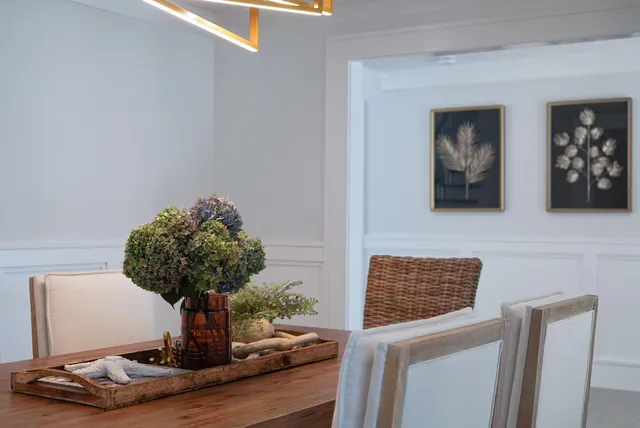a view of a dining room with furniture window and outside view