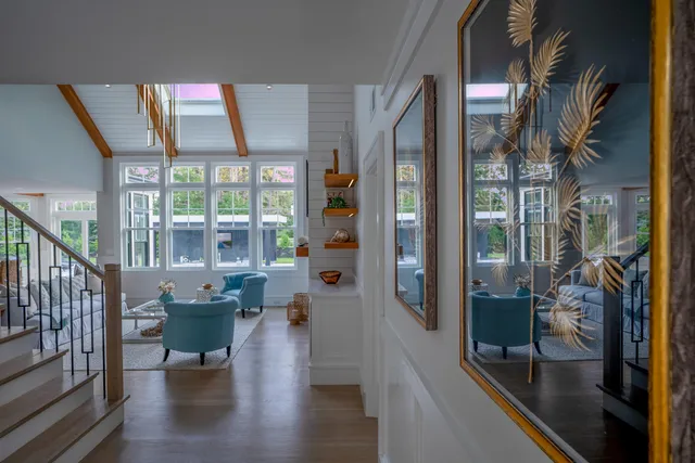 a view of lobby with a chair and potted plants