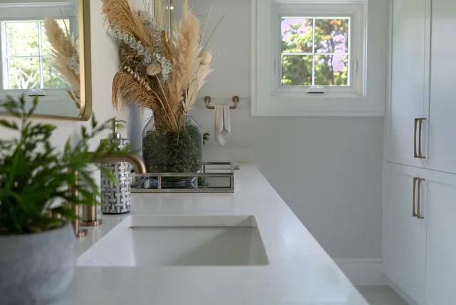 a view of a backyard with furniture and a garden