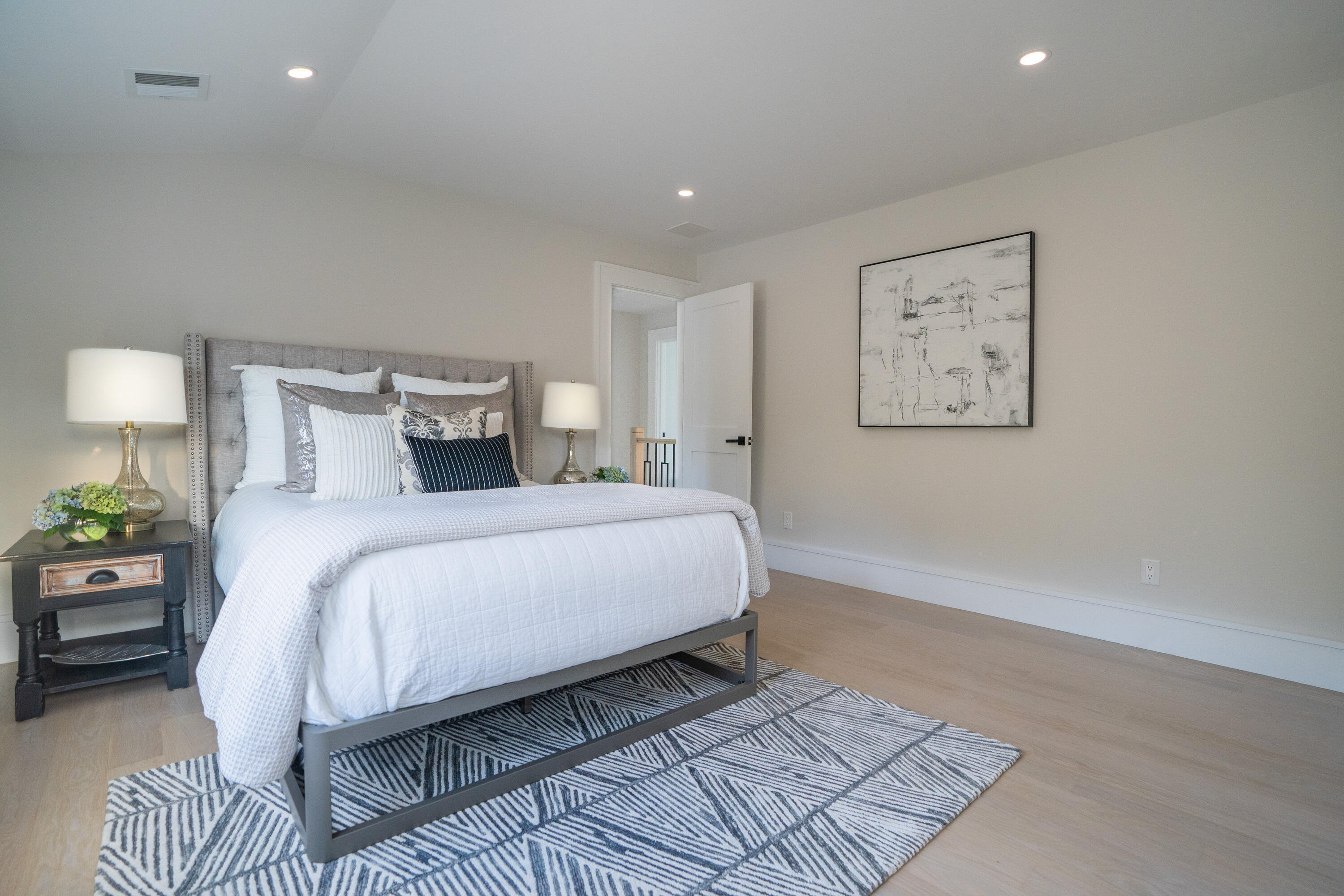 171 Searsville Road South Dennis, MA 02660 - Photo 55 of 100 a bedroom with a bed and a painting on the wall