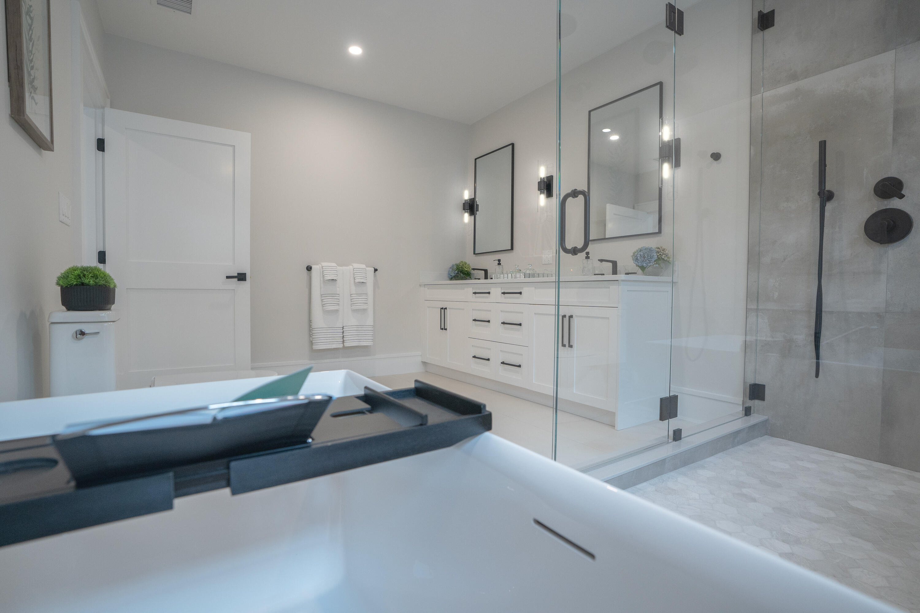 171 Searsville Road South Dennis, MA 02660 - Photo 70 of 100 a spacious bedroom with a bed and walk in closet