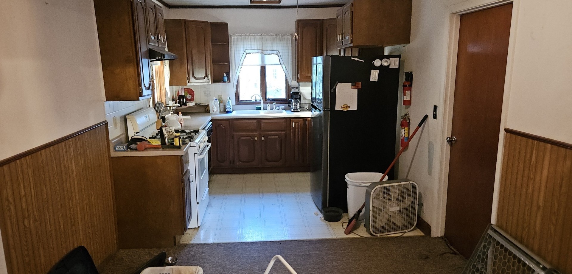 4820 8th Street Rock Island, IL 61201 - Photo 12 of 17 a bathroom with a sink and a mirror