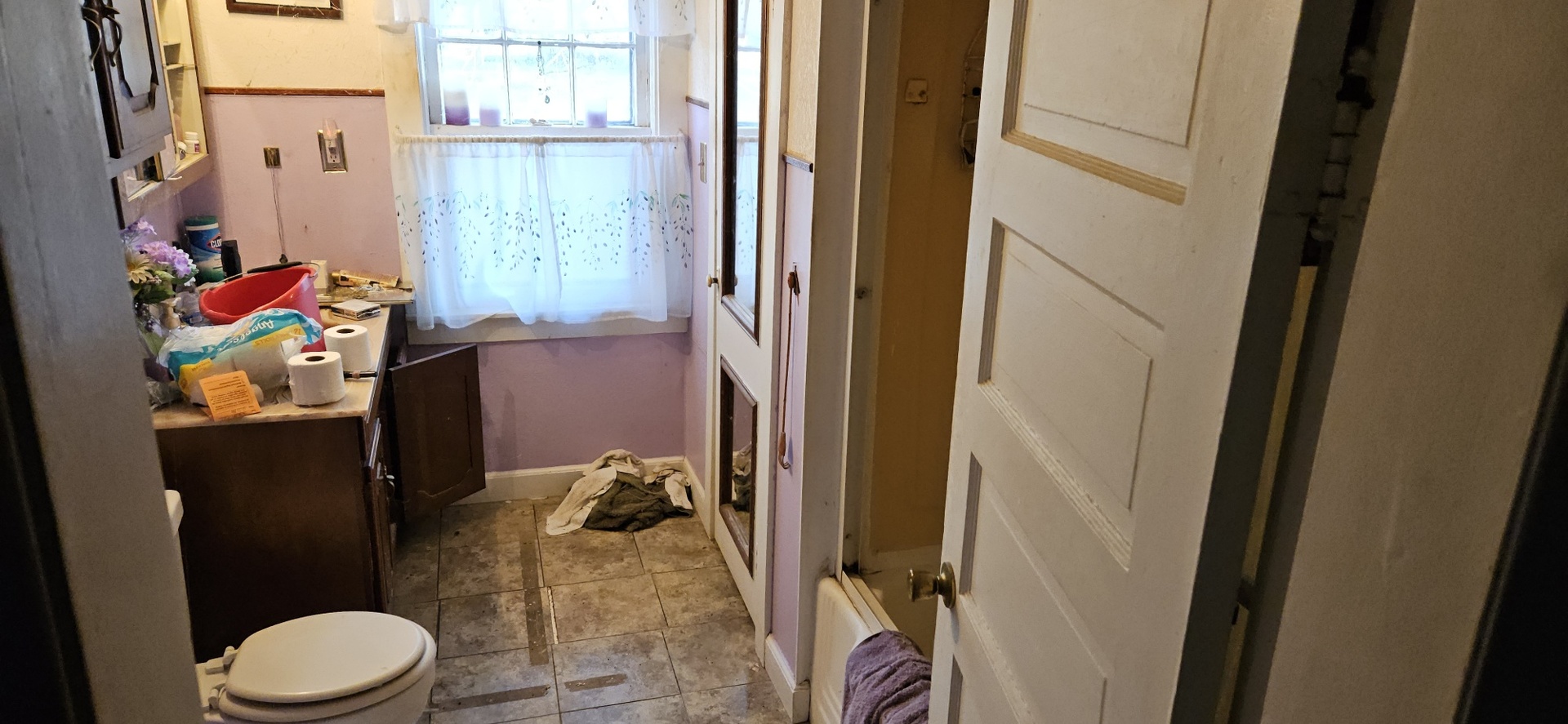 4820 8th Street Rock Island, IL 61201 - Photo 13 of 17 a bathroom with a toilet sink and window