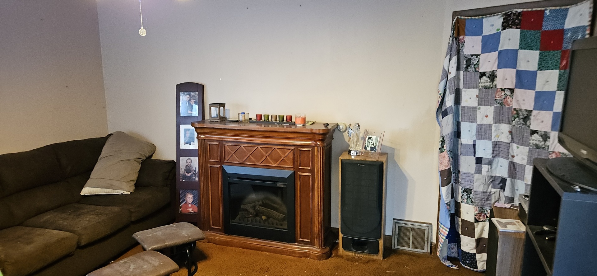 4820 8th Street Rock Island, IL 61201 - Photo 16 of 17 a living room with furniture and a fireplace